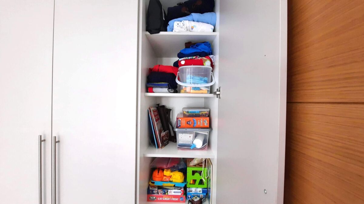 A kid's wardrobe reorganisation project toy storage before