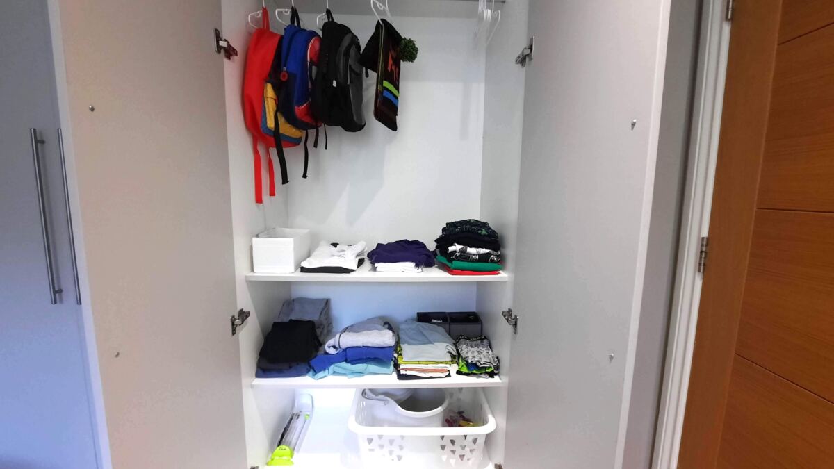A kid's wardrobe reorganisation project wardrobe after