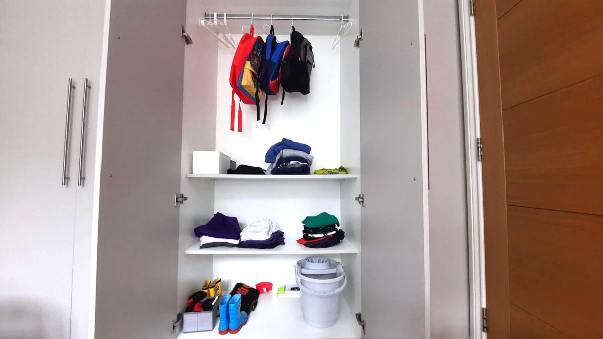 A kid's wardrobe reorganisation project wardrobe before