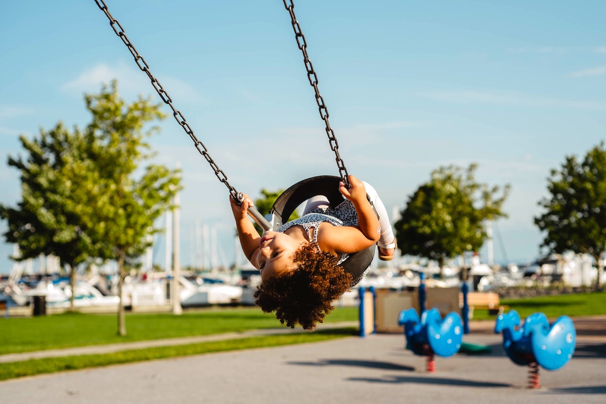 How to harness kids' natural energy girl on a tyre swing