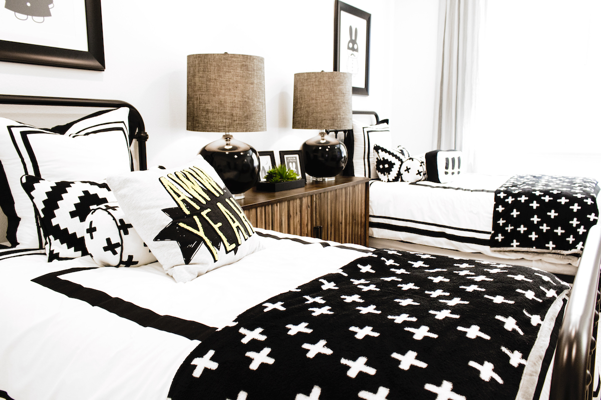 8 tips to create a morning routine for kids - kids bedroom with 2 single beds and black bedding.