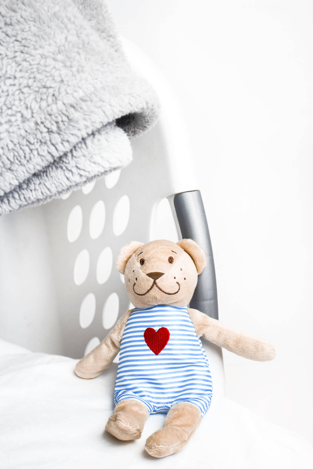 Love from Lisa parenting and lifestyle blog - laundry hamper with toy bear.
