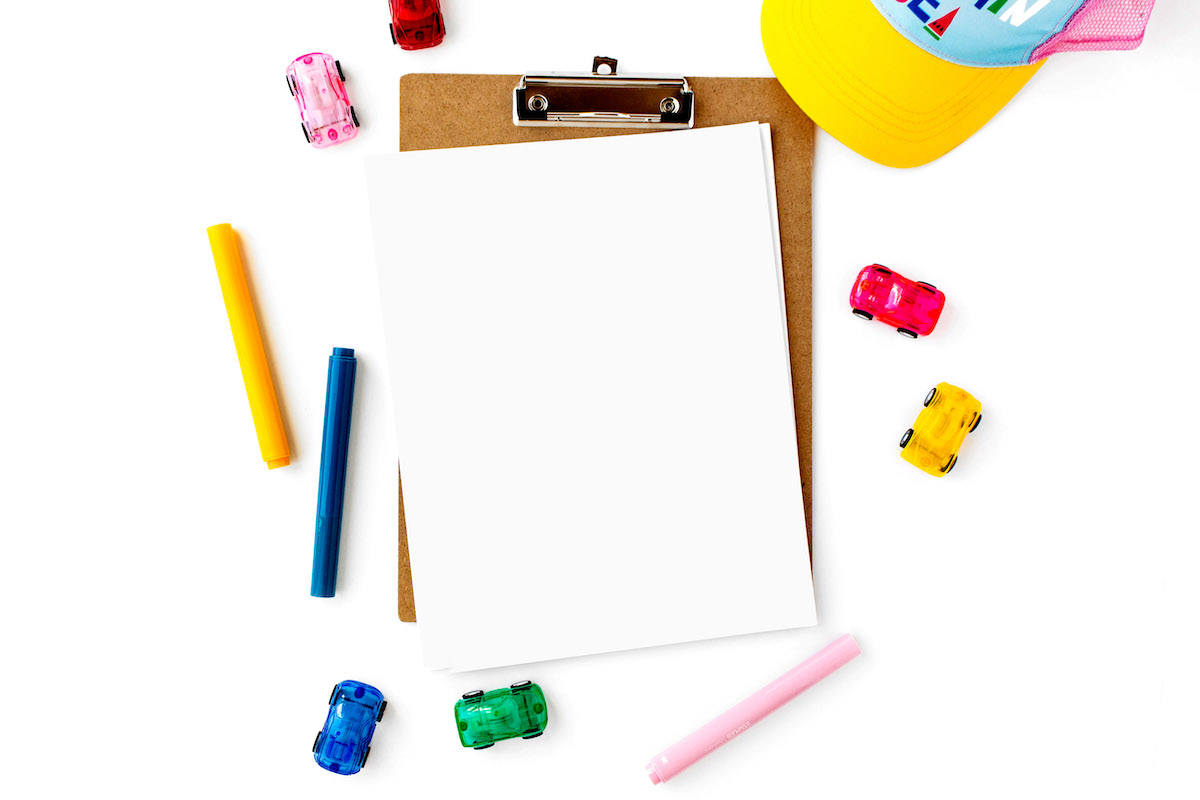 Ultimate guide to keeping your kids engaged all summer - markers, paper, clipboard, cars and hat.