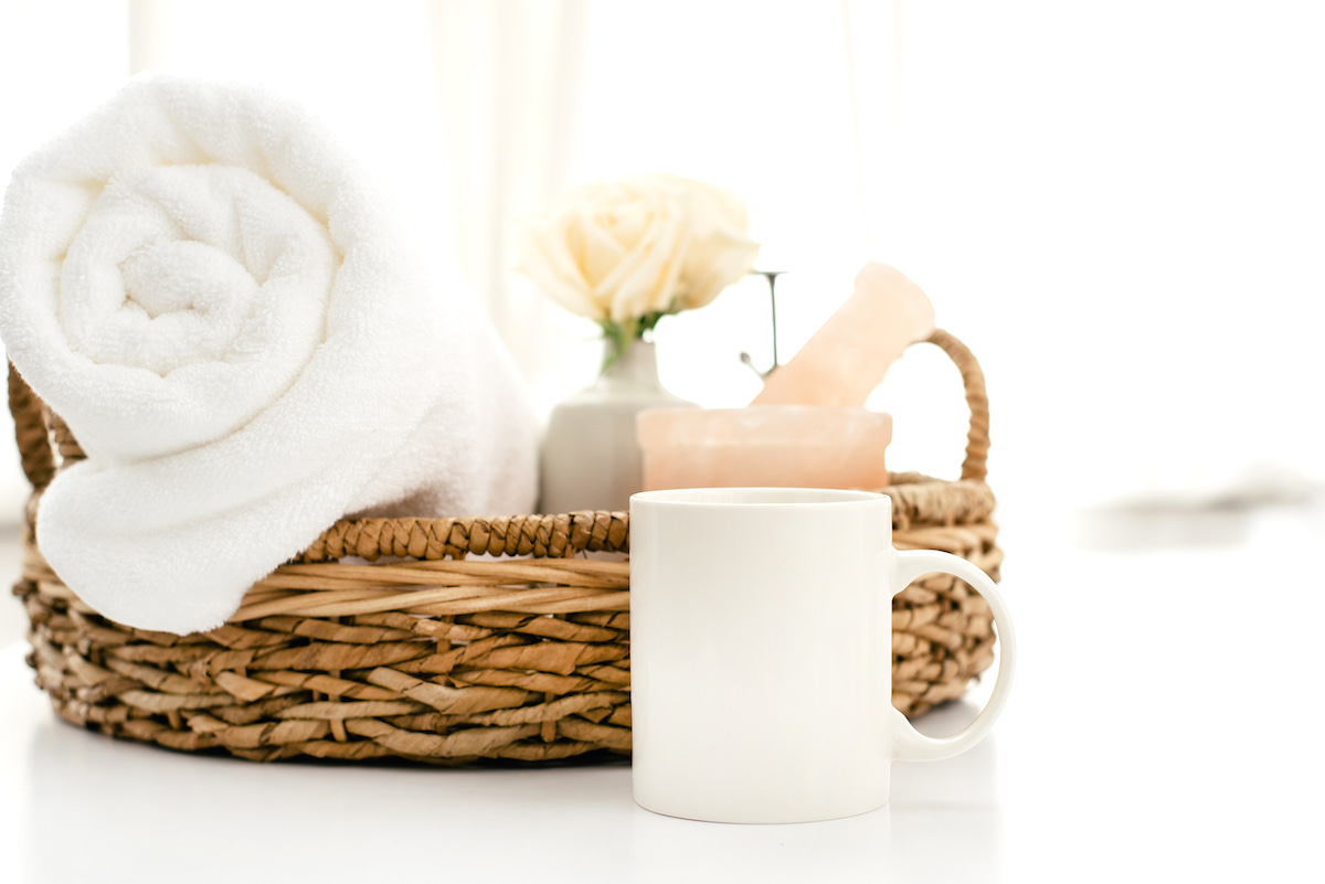 Self-care tips for mums - basket with wellness items, and a mug.