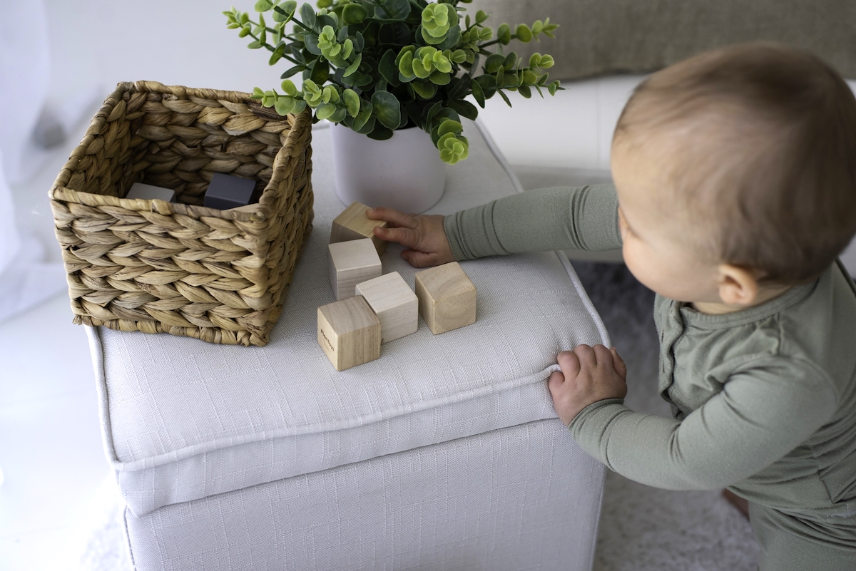 Strategies for working mums to overcome mum burnout overcoming mum burnout - baby playing with blocks.