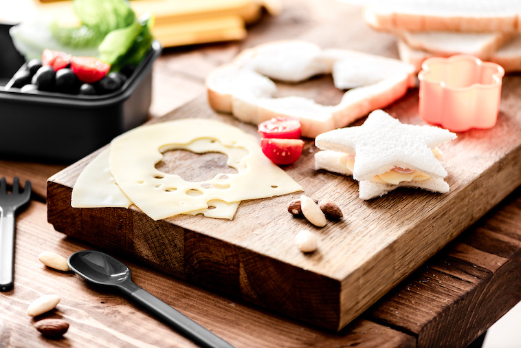 Wooden board with a sandwich in the shape of a star - just one of the many perfect dinner ideas for fussy toddlers.