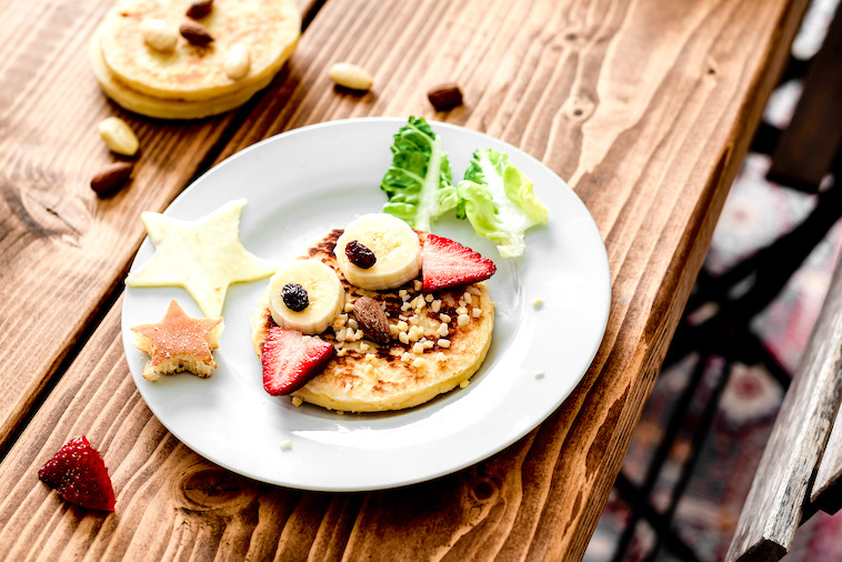Plate with a pancake decorated as an owl - just one of the many perfect dinner ideas for fussy toddlers.
