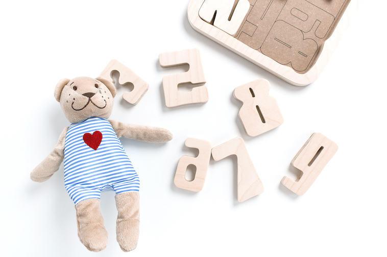 Soft toy and puzzle, one of the tips for flying with toddlers.