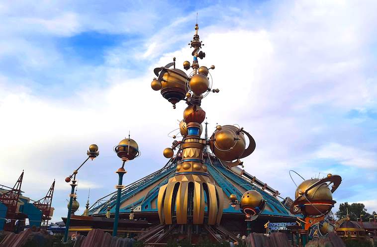 Gold statue with planets surrounding it - one of the things to see when visiting Disneyland Paris in one day.