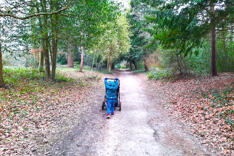 Boy pushing a stroller - one tip to help decide when to stop using a stroller