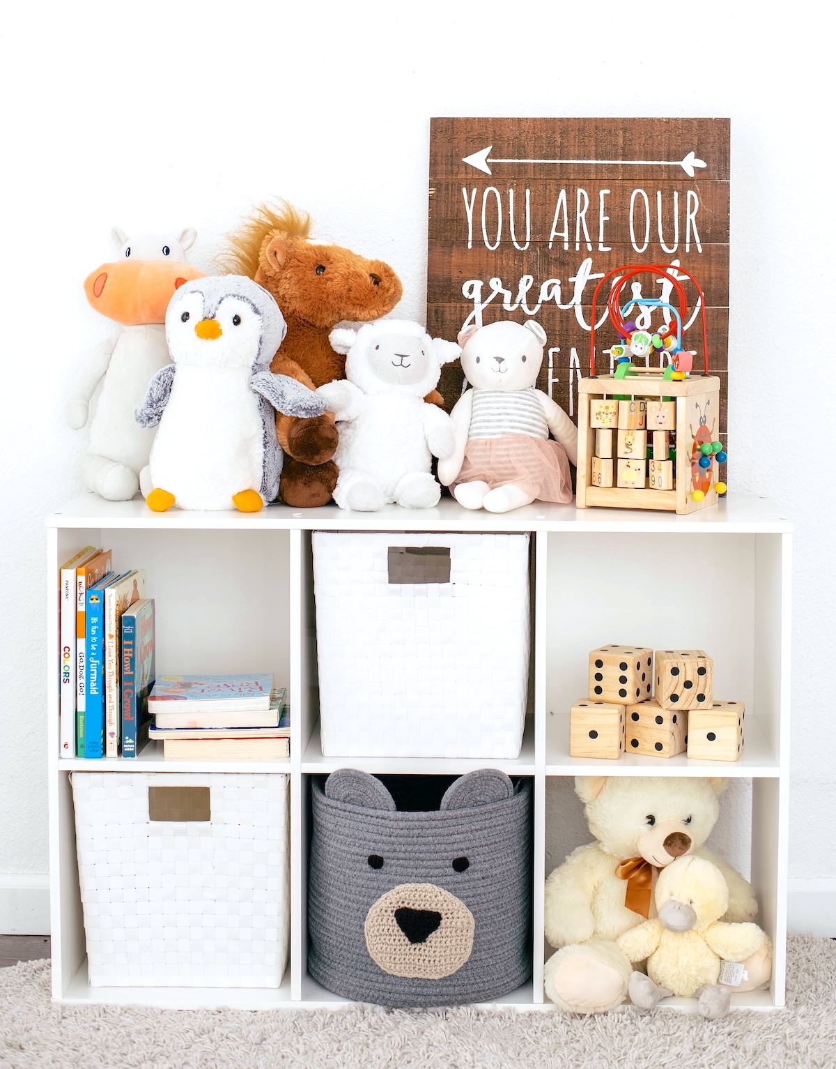 Toy storage unit with toys - one of the ways to organise your home and family life.