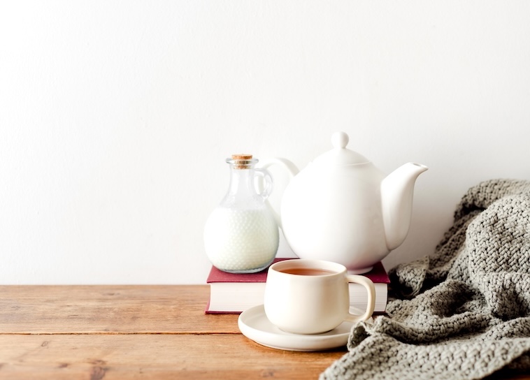 Milk, tea pot, cup of tea, blanket - items you can use when finding time for yourself.