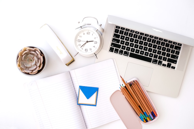 Laptop, pencils, notebook, envelope, plant, stapler, clock - school supplies you can buy when making school traditions.