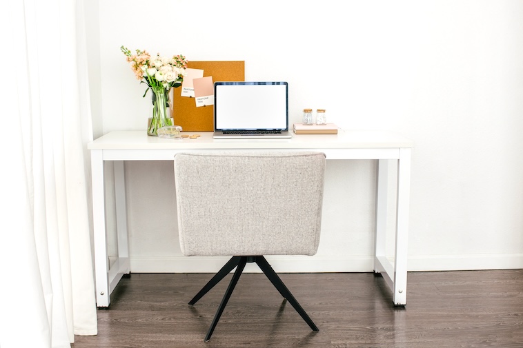 Flowers, corkboard, stapler, and a laptop - some of the things you need when starting a new business.