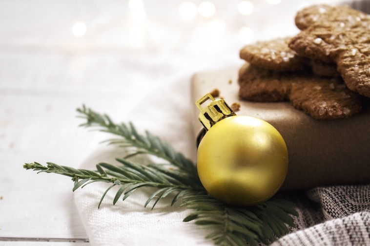 Gold Christmas bauble, with gingerbread men - baking is something to add to your Christmas bucket list.