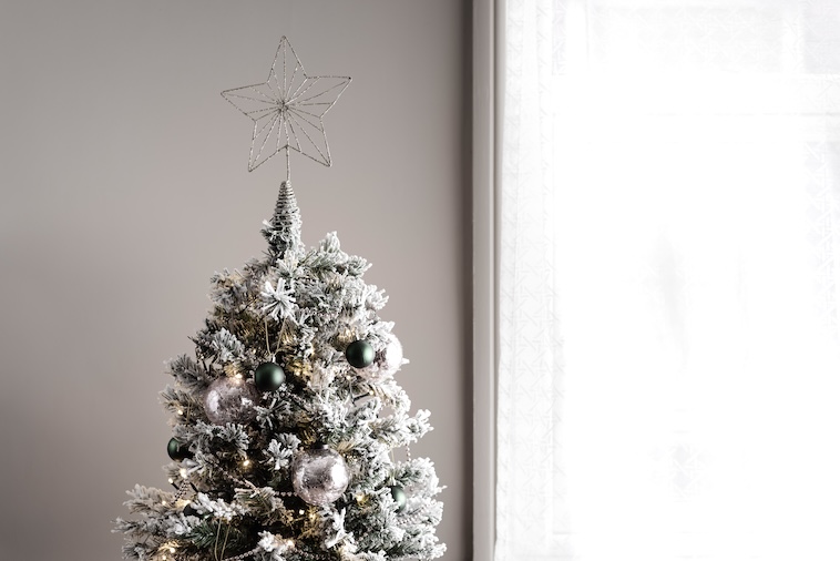 Christmas tree with star on top - decorating a Christmas tree is something to add to your Christmas bucket list.