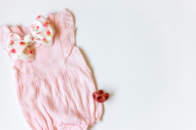 Pink baby clothing - comforting things you can use as ways to reduce a baby’s fever.