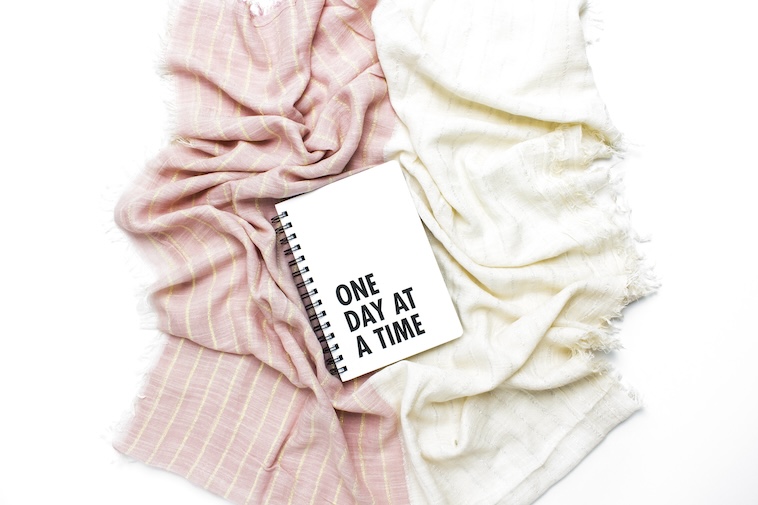 A notebook on some scarves - a way to collect ideas to overcome mum burnout.