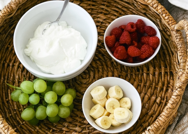 Grapes, yoghurt, berries, bananas - some snacks for school lunches that are easy to prepare.