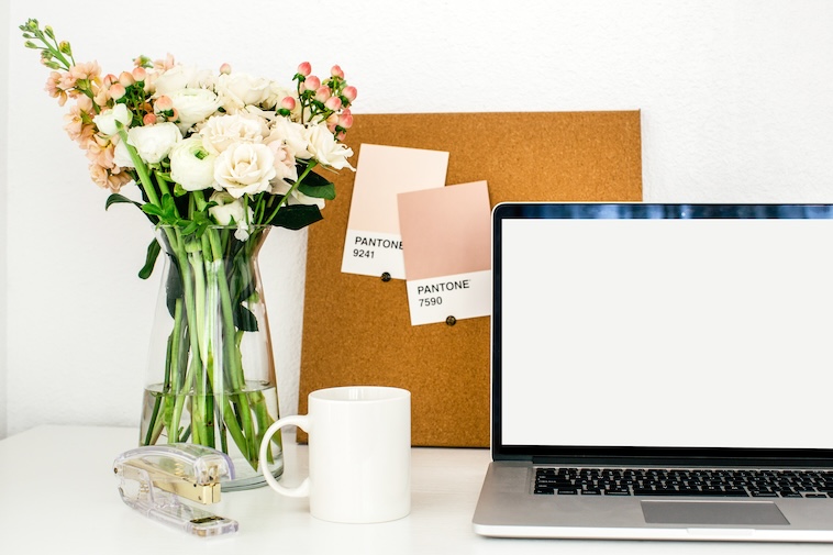 Flowers, corkboard, stapler, coffee mug, and a laptop - some of the things you need when starting a new business.