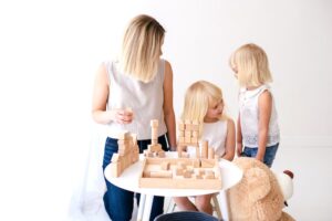 Family playing blocks - family goals can include playing games.